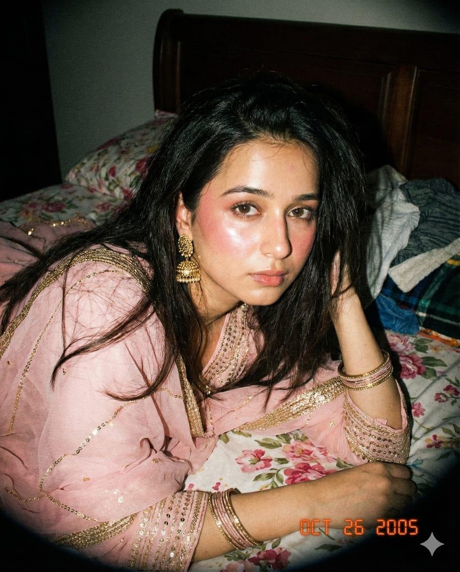 Nostalgic lo-fi flash portrait on floral bedding